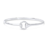 A solid sterling silver bangle bracelet with a snaffle bit design and sparkly cubic zirconia stones, presented against a white background.
